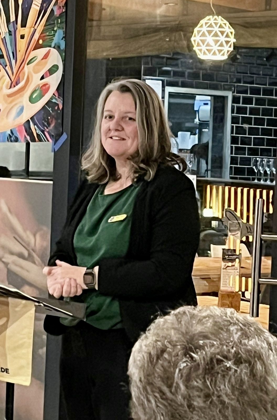 Michelle coaching a room at a speaking club evening